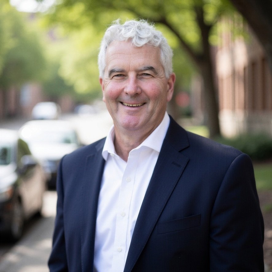 stev handel headshot Smiling businessman in navy suit